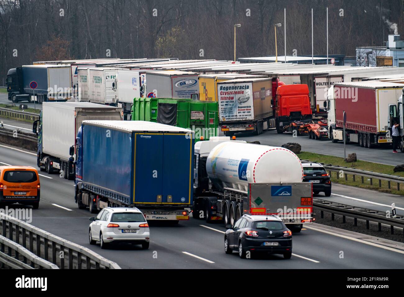 Heavy traffic at the Recklinghausen junction of the A2 and A43 motorways, heading west, Hohenhorst service area, overflowing with lorries, NRW, German Stock Photo