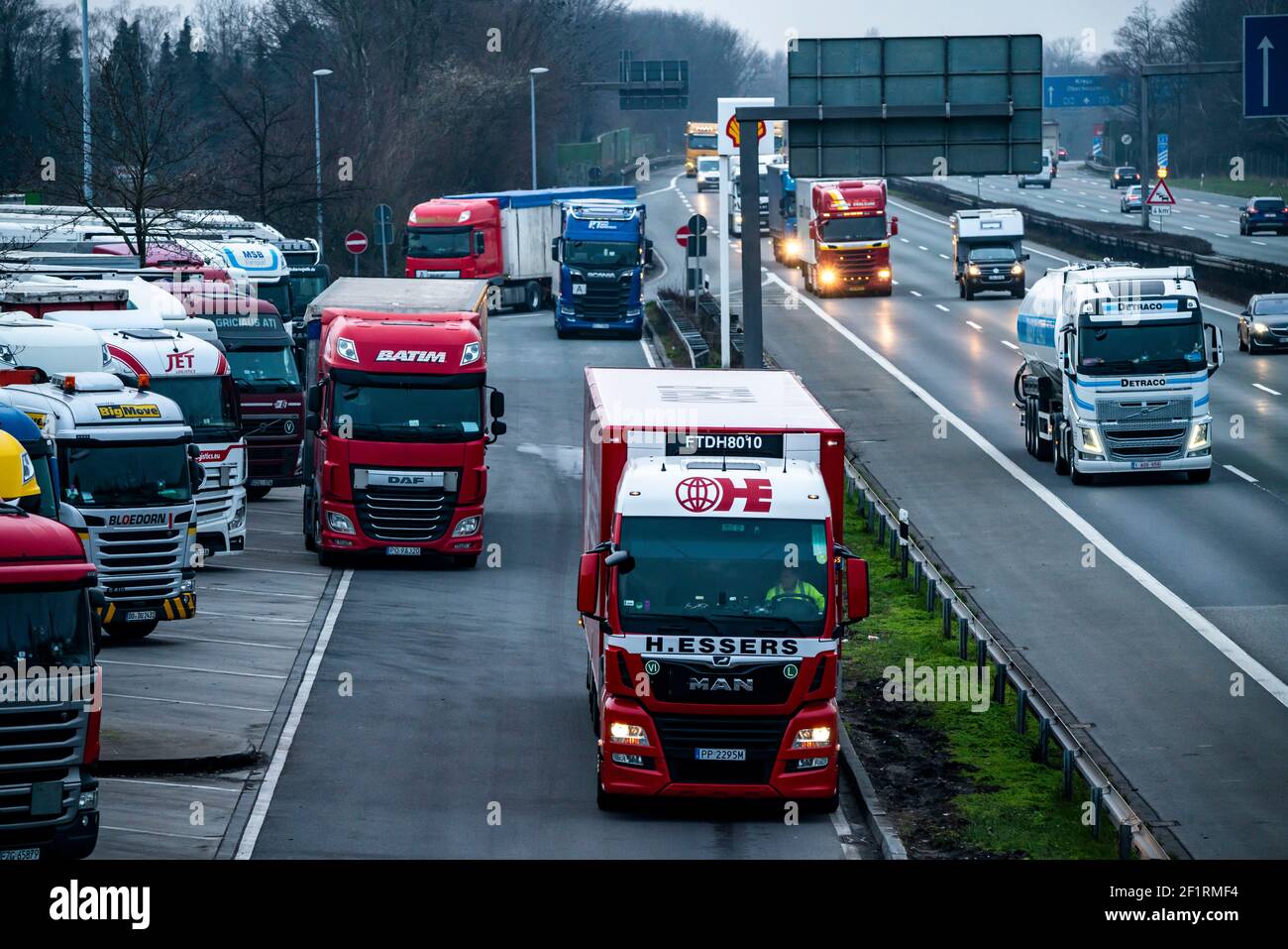 Heavy traffic on the A2 at the Bottrop-Süd service area, overcrowded car park for trucks in the evening, Bottrop, NRW, Germany Stock Photo