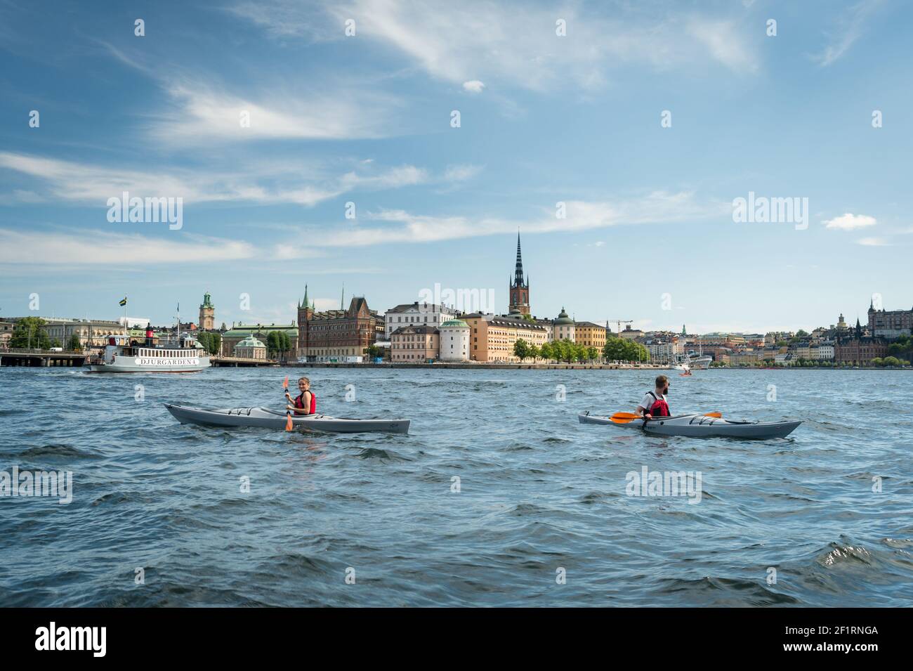 Kayakers on Riddarfjärden in front of Riddarholmen, Stockholm, Sweden. Stock Photo