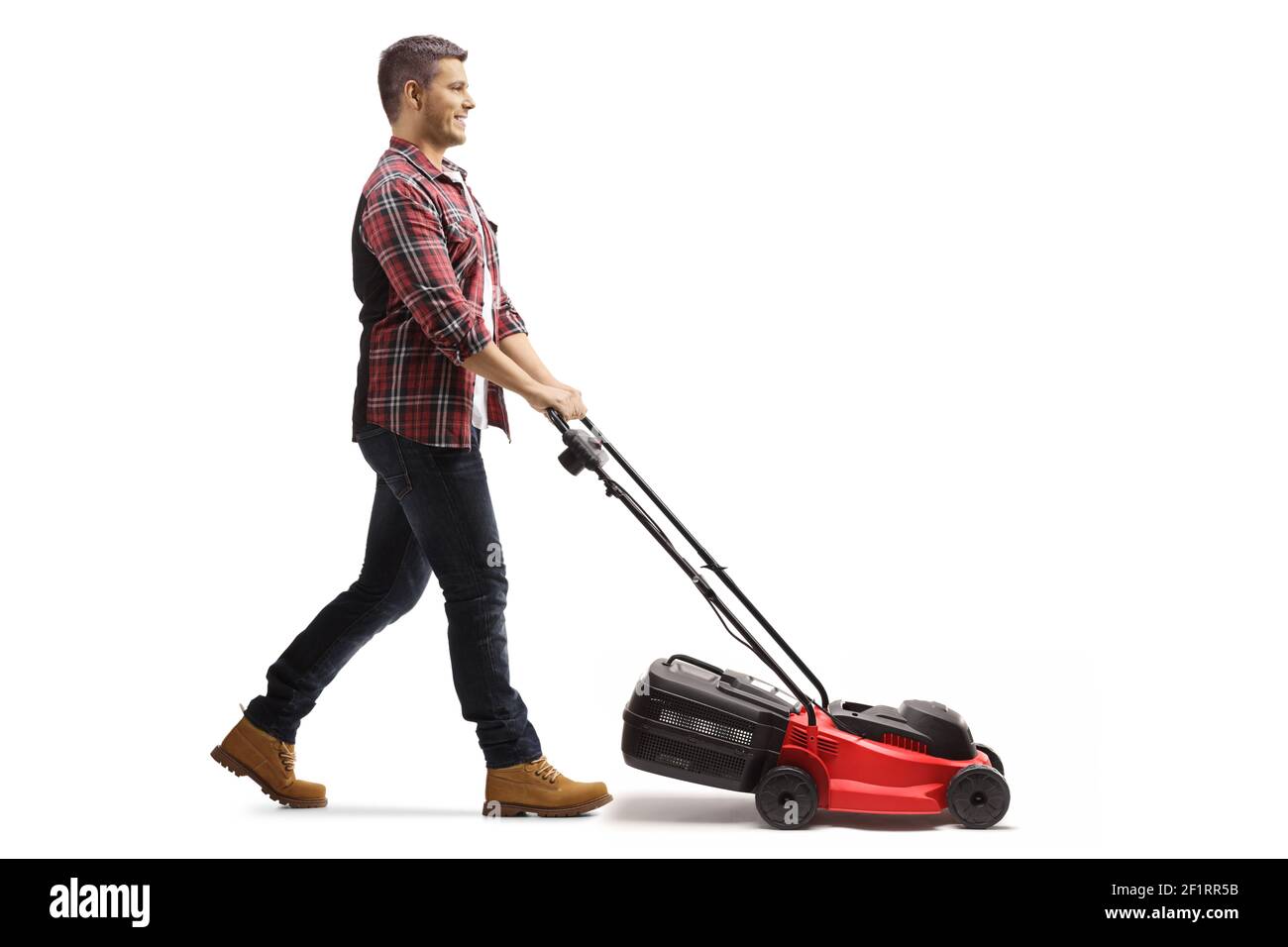 Full length profile shot of a young man working with a lawnmower isolated on white background Stock Photo
