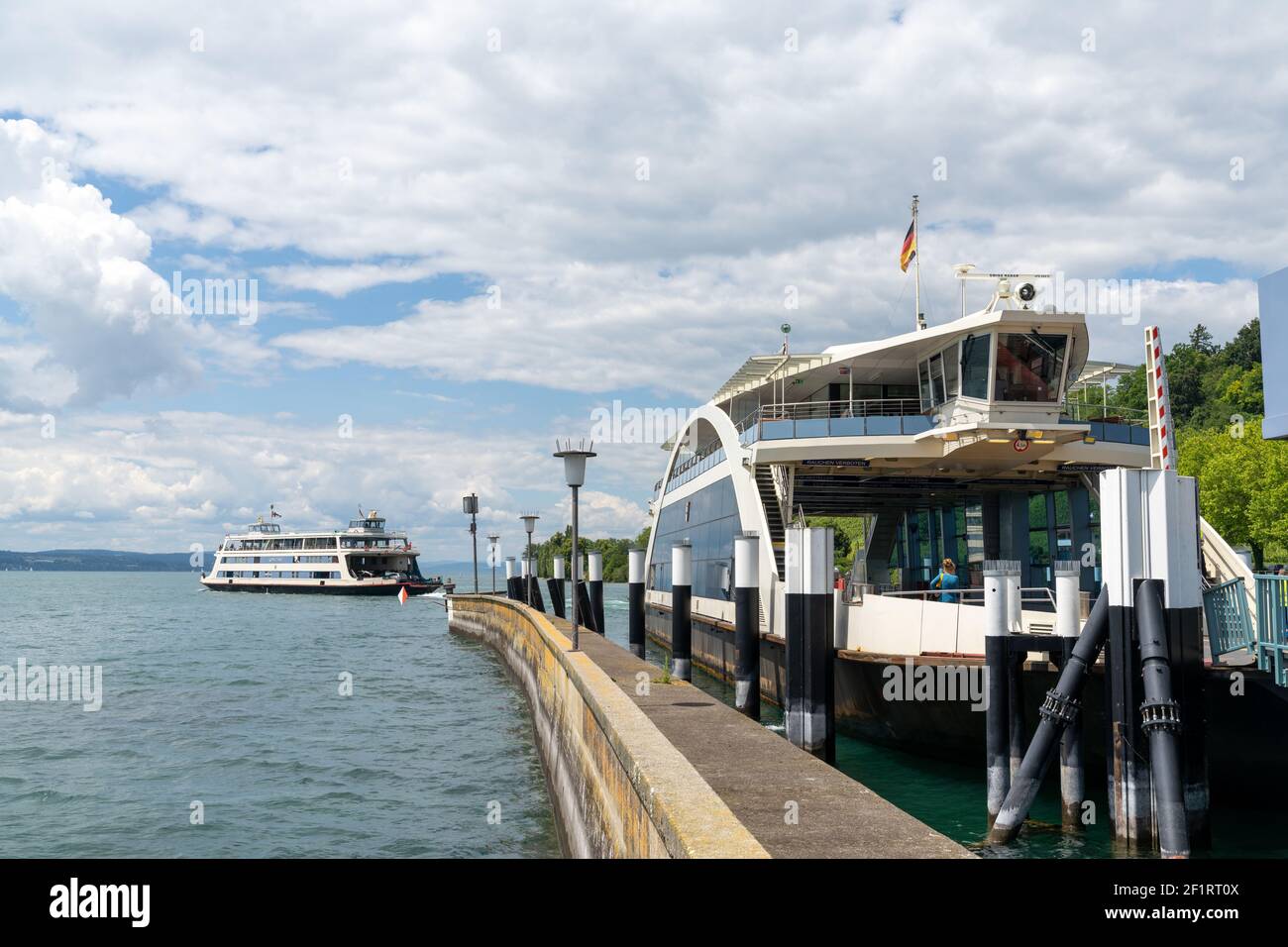 The car and passenger departing from Meersburg harbor towards Konstanz in southern Germany Stock Photo