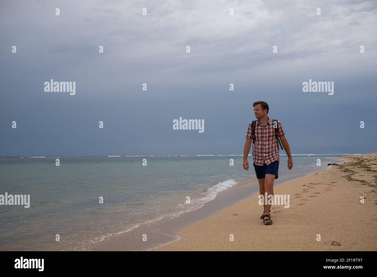 Lonely person walking on sandy hi-res stock photography and images - Alamy