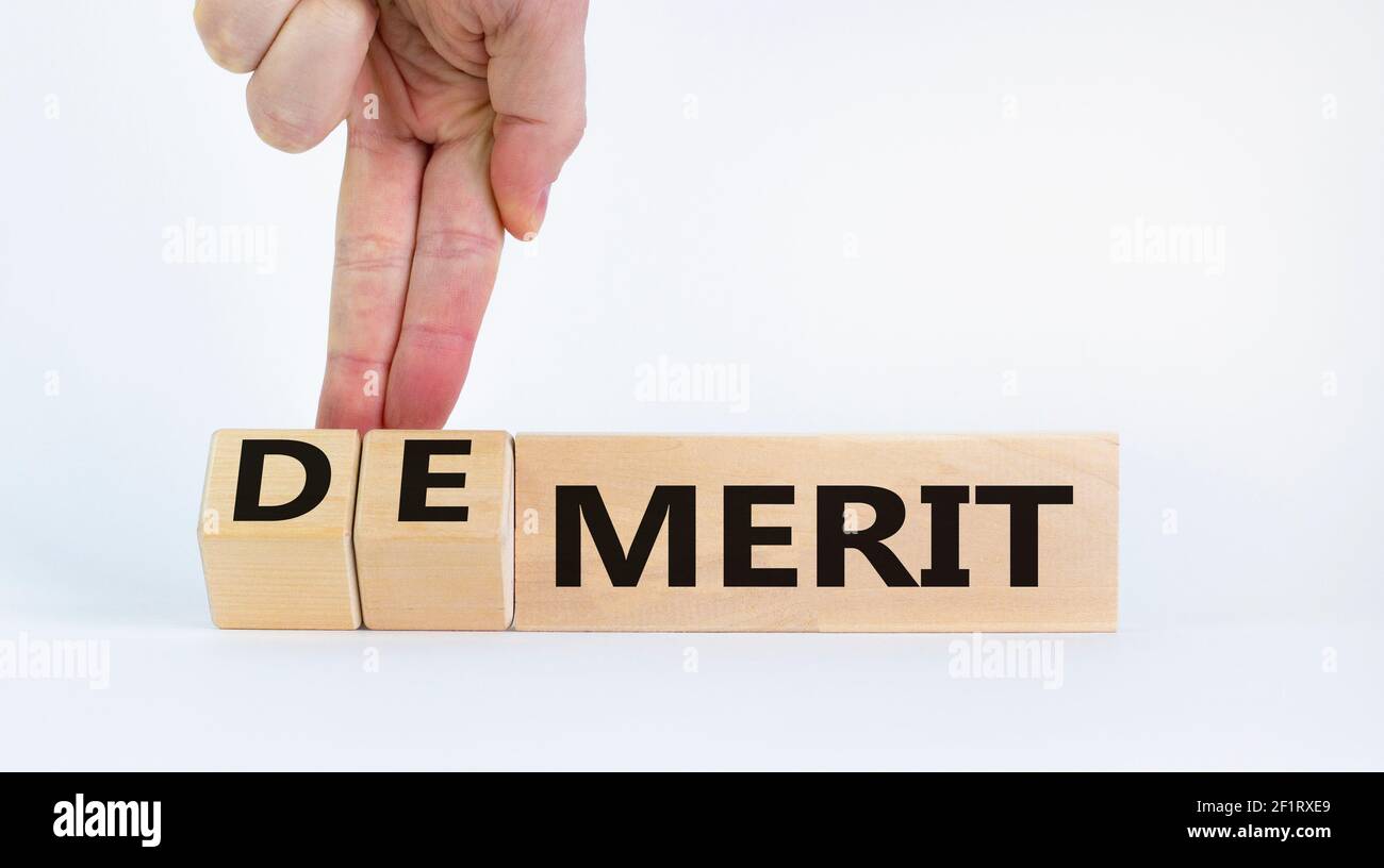 Demerit Or Merit Symbol Businessman Turns Wooden Cubes And Changes Demerit Or Merit Symbol Businessman Turns Wooden Cubes And Changes