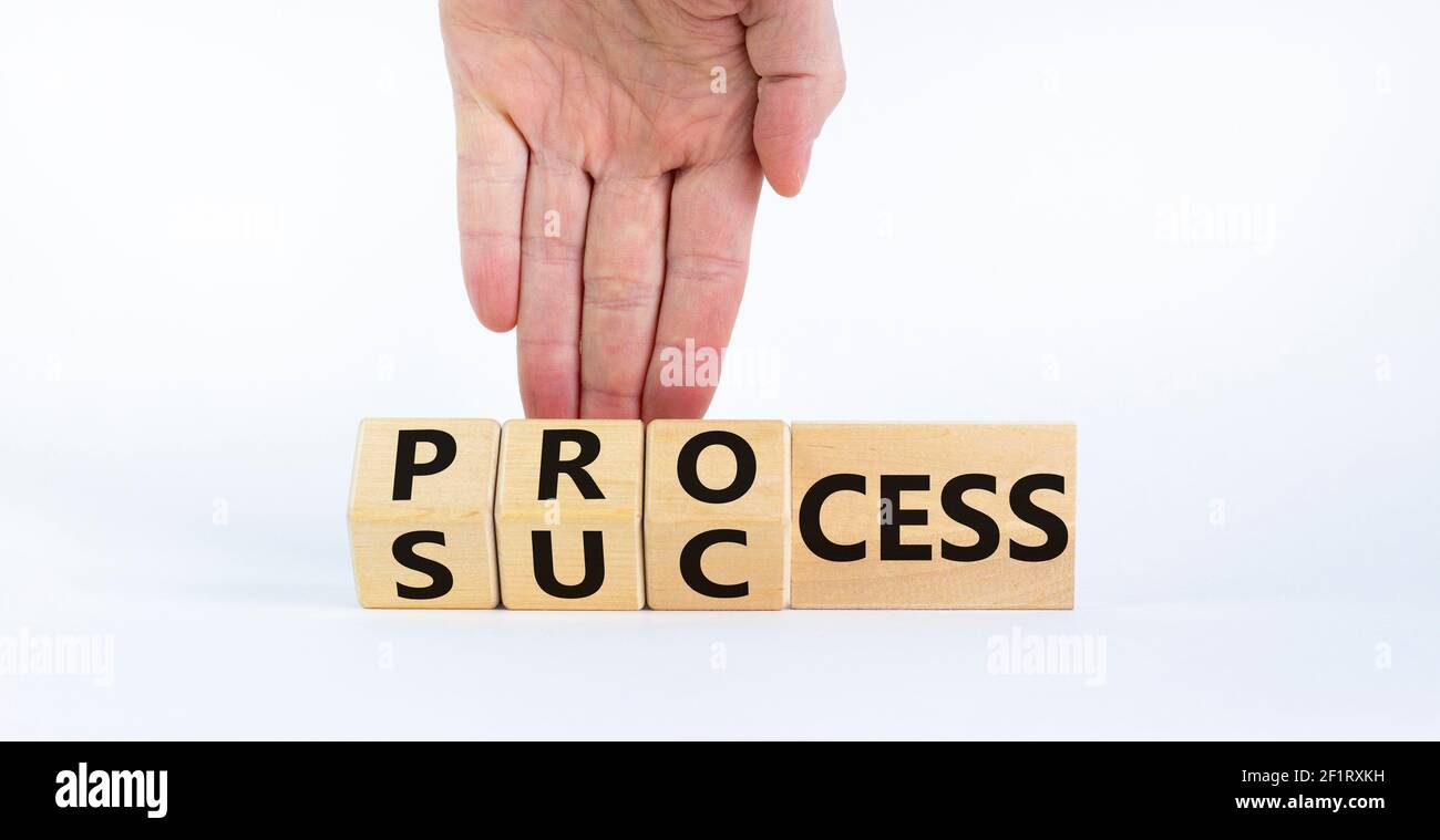 Success process symbol. Businessman turns wooden cubes and changes the ...