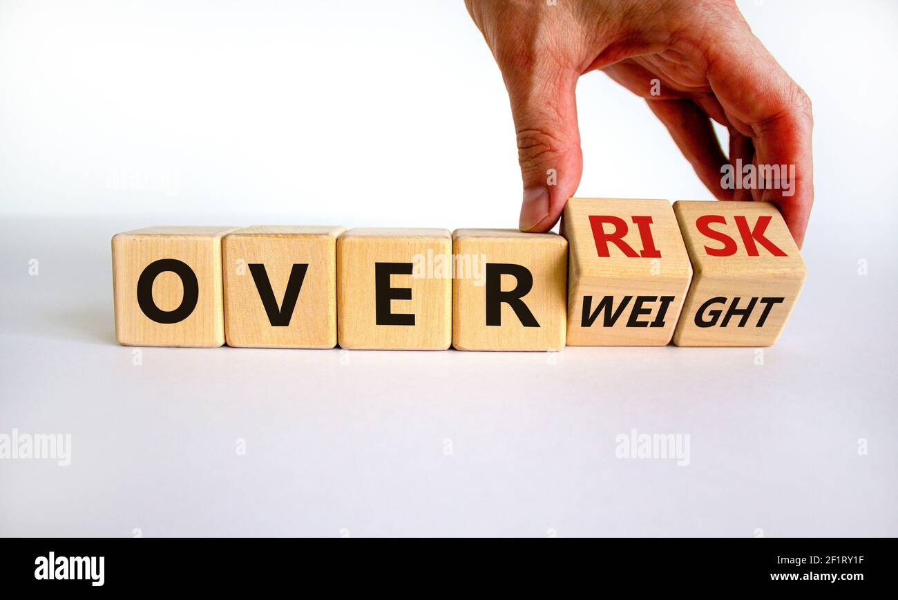 High risk from overweight symbol. Doctor turns wooden cubes and changes ...