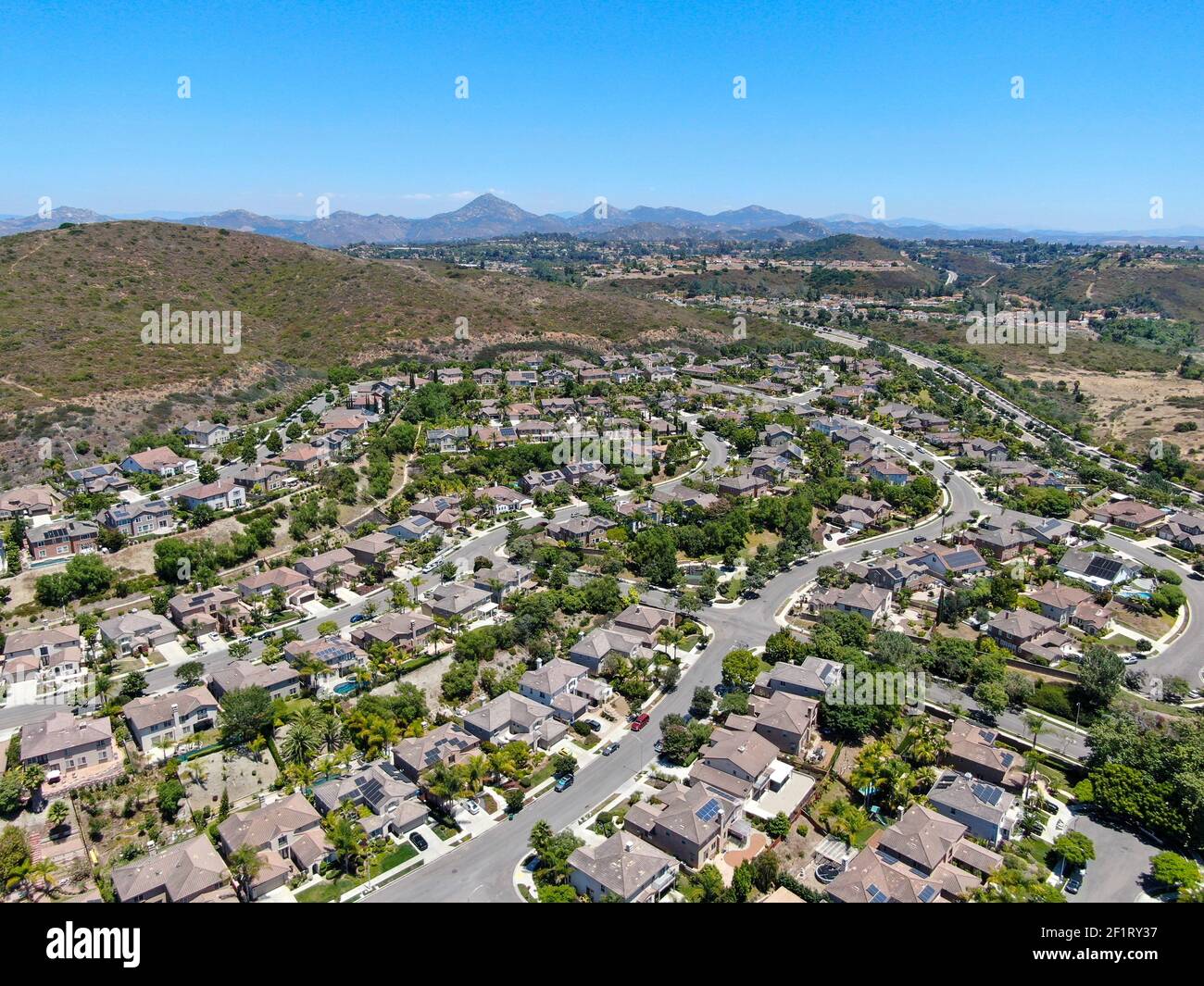 Aerial view of suburban neighborhood with big mansions in San Diego