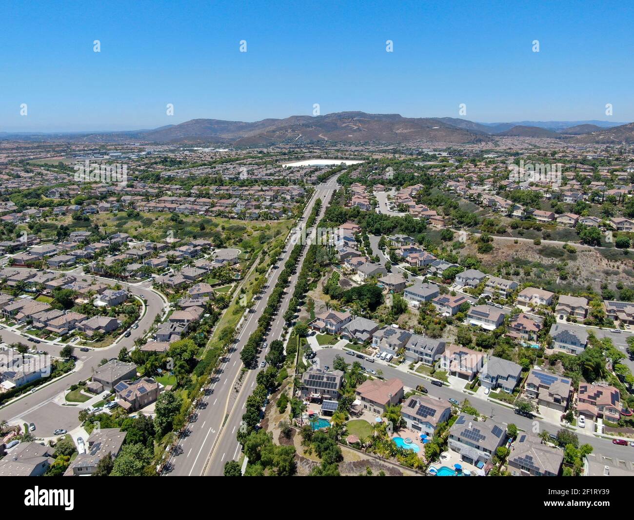 Aerial view of suburban neighborhood with big mansions in San Diego