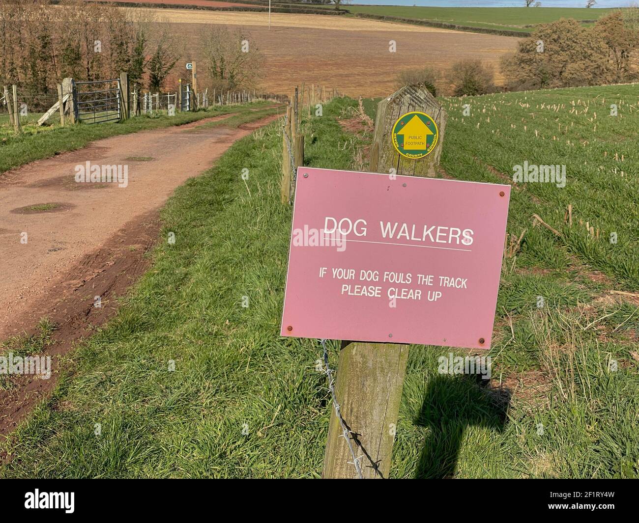 Dog Walkers Sign to Please Clear Up if Your Dog Fouls the Track on a Devon County Council Public Footpath on a Farm in the Rural Devon Countryside Stock Photo