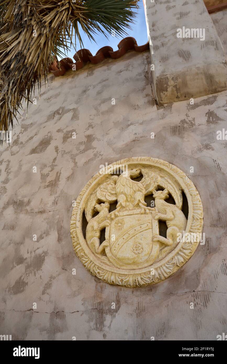 Carved shield on the exterior of Scotty's Castle,  Death Valley, California Stock Photo