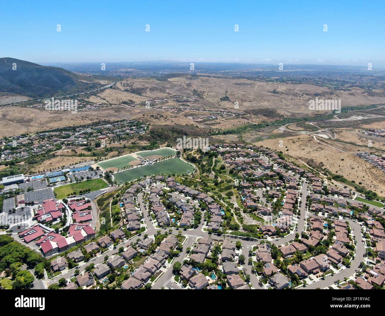 Aerial view of suburban neighborhood with big mansions in San Diego