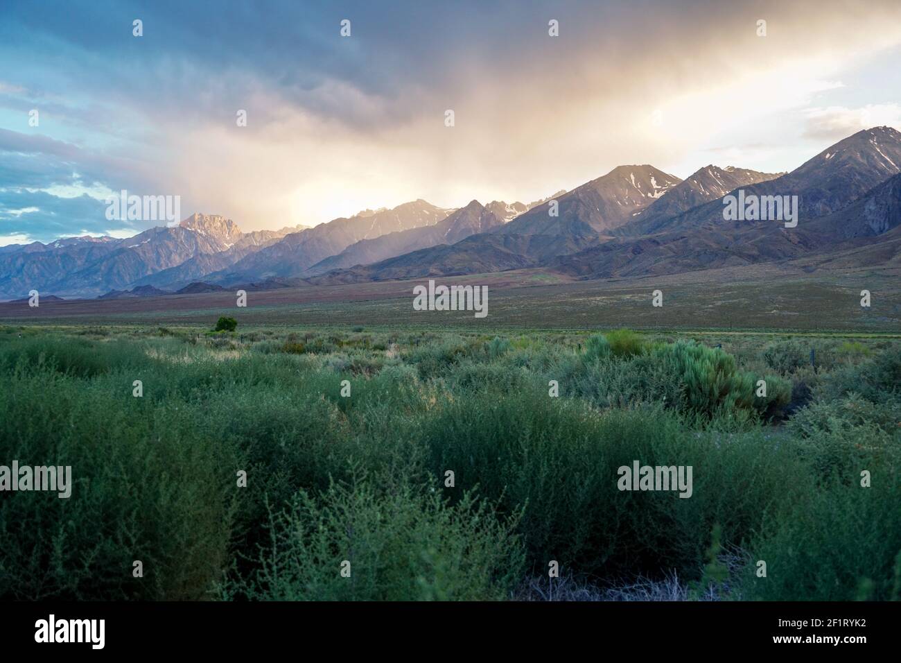 Mountain range with clouded colorful sunset, Eastern Sierra Nevada Mountains Stock Photo