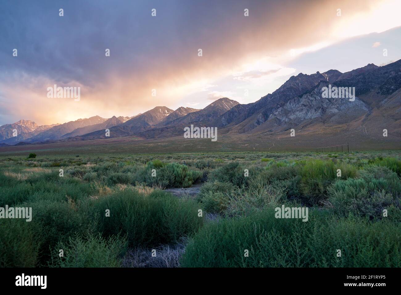 Mountain range with clouded colorful sunset, Eastern Sierra Nevada Mountains Stock Photo