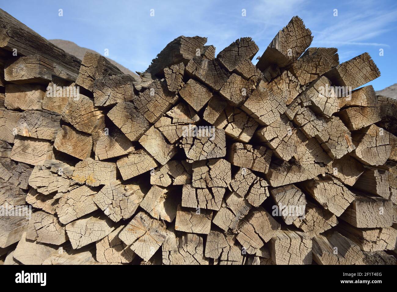 Old railway ties piled up at Scotty's Castle,  Death Valley, California Stock Photo