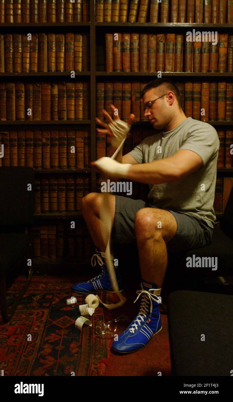 TOWN V GOWN BOXING AT OXFORD UNIVERSITY UNION. J BOYCE PREPARES FOR A