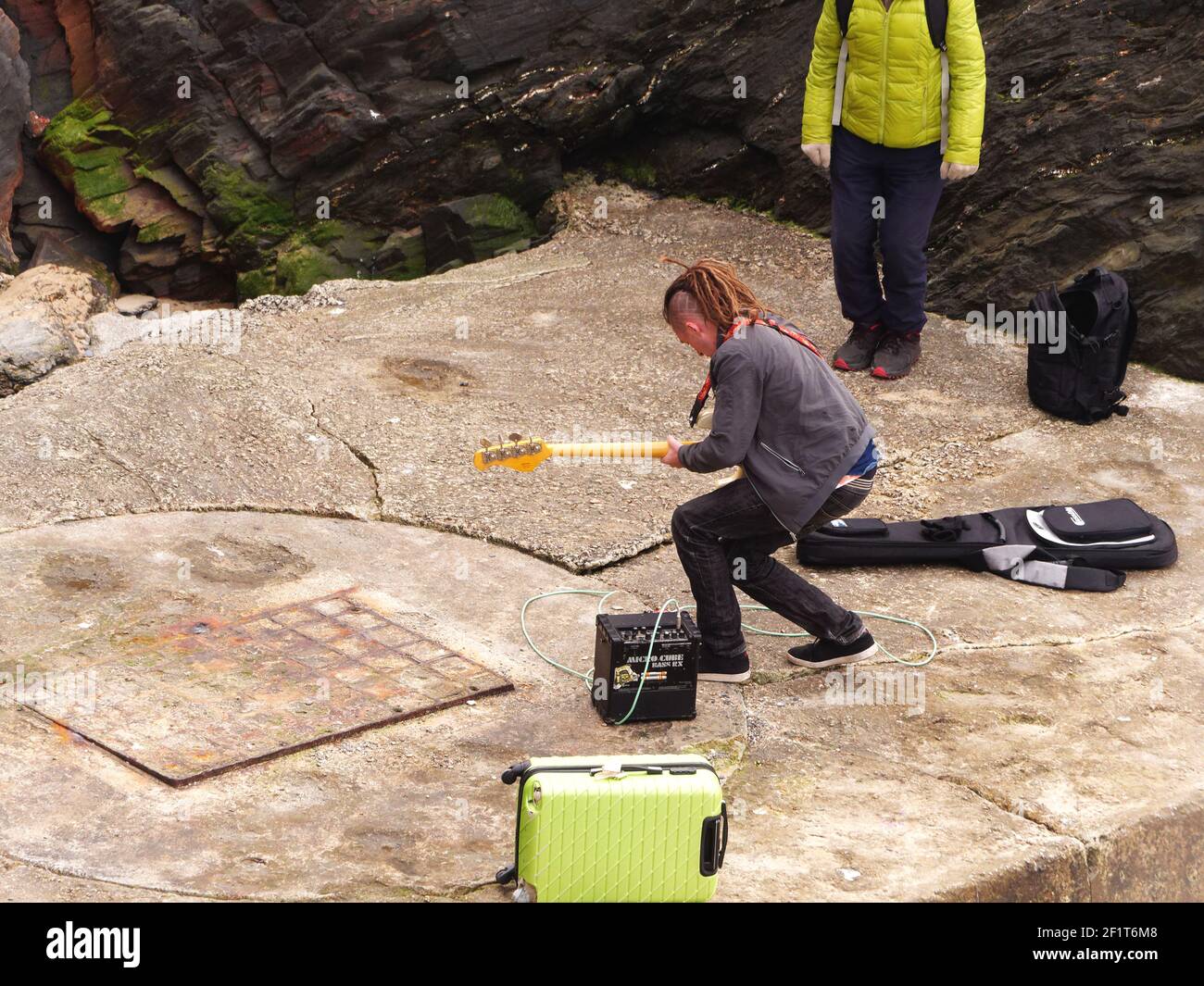 Newquay,Cornwall, 09th March 2021. You Tube sensation Jonny Rubin known as Dr Funk with 10 million plus views. Started as a busker in Newquay, here recording his latest video at Towan beach, Jonny born in California and raised in Sunderland makes his home in Cornwall. His fame is based on funky blues based bass guitar playing.  Credit: Robert Taylor/Alamy Live News” Stock Photo