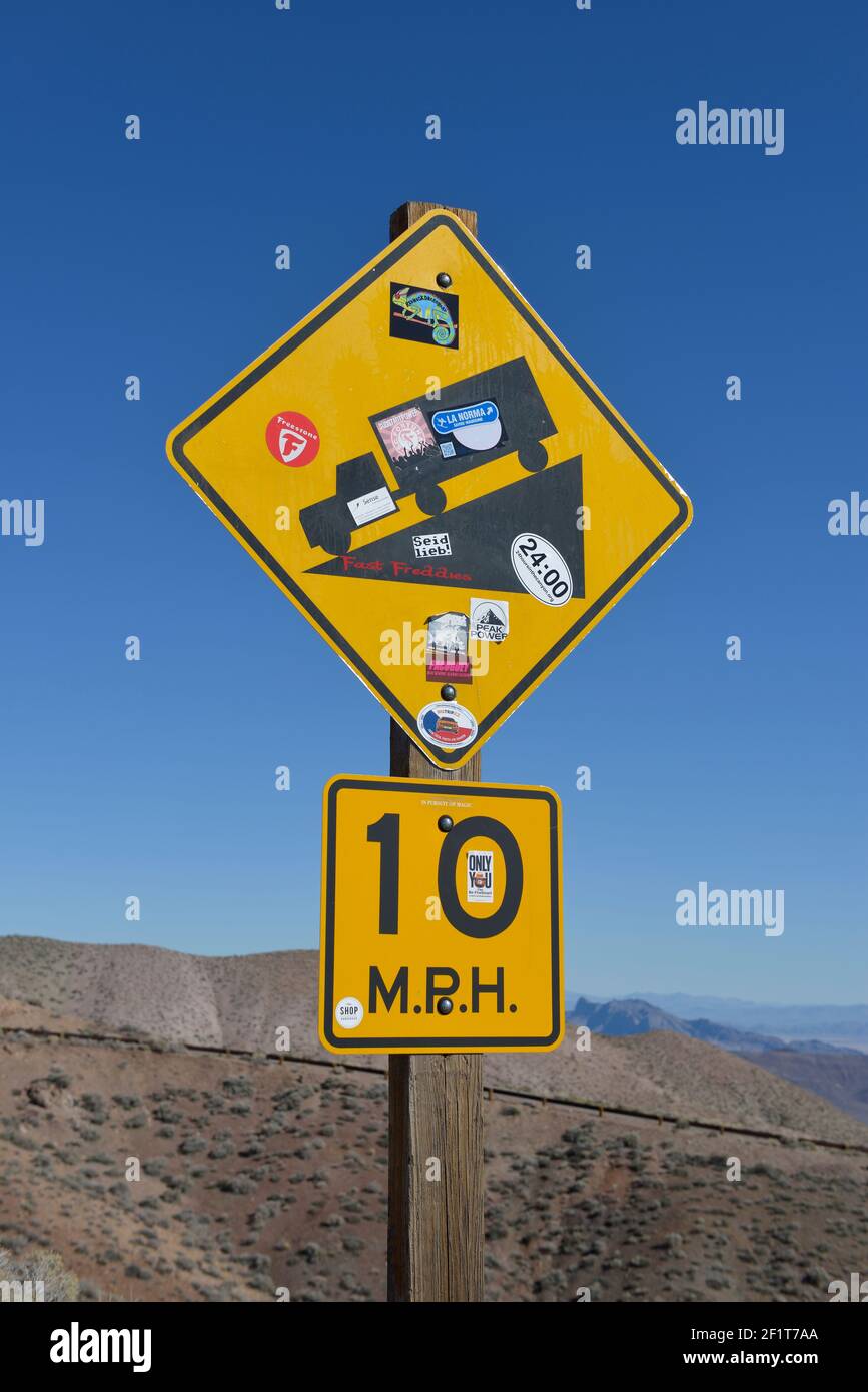 Steep road sign with stickers, Death Valley, California Stock Photo