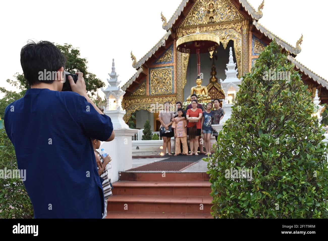 Man taking pictures of a Thai family, Chiang Mai , Thailand Stock Photo