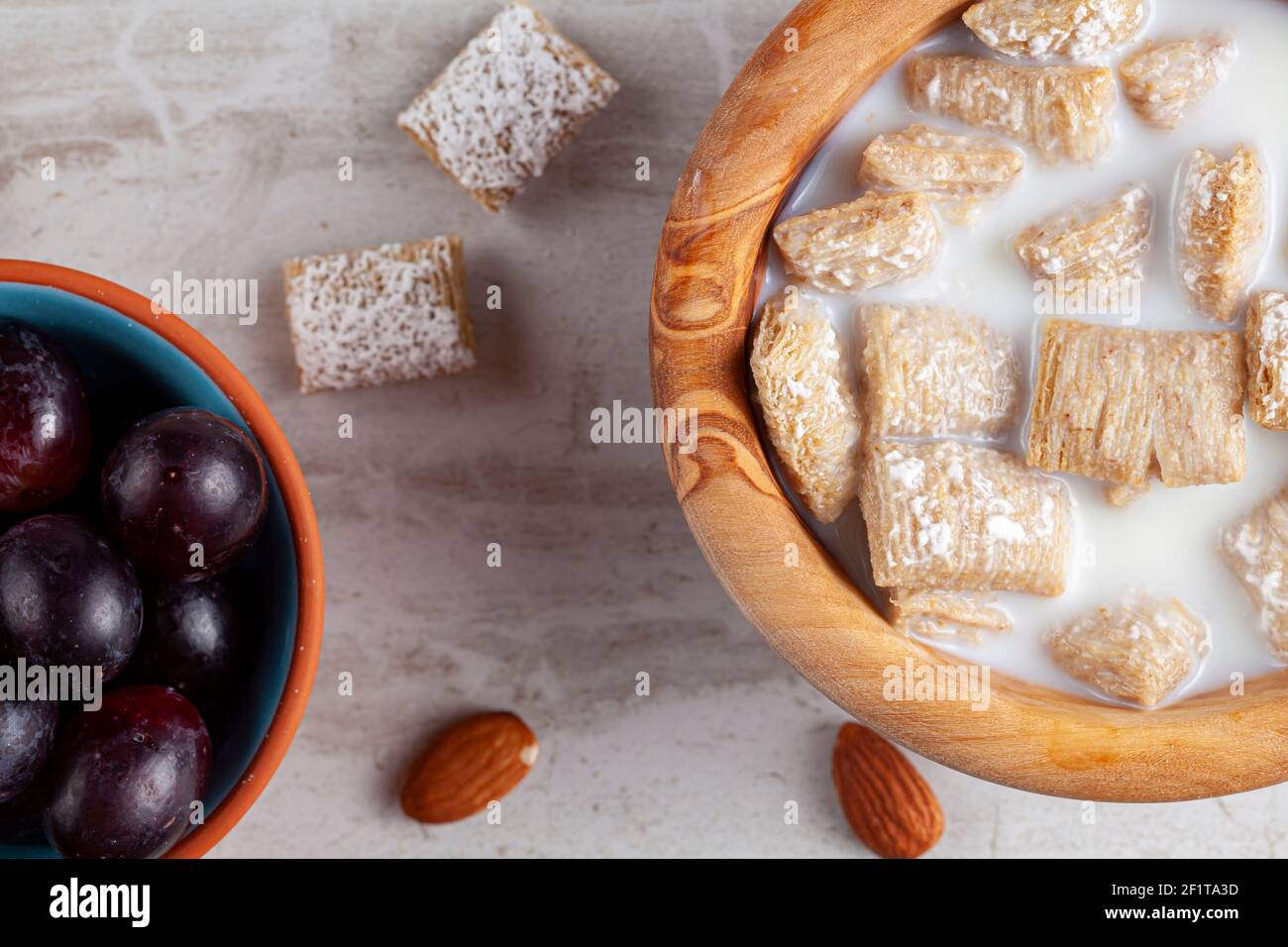 A simple breakfast concept with a bowl of frosted bite size wheat