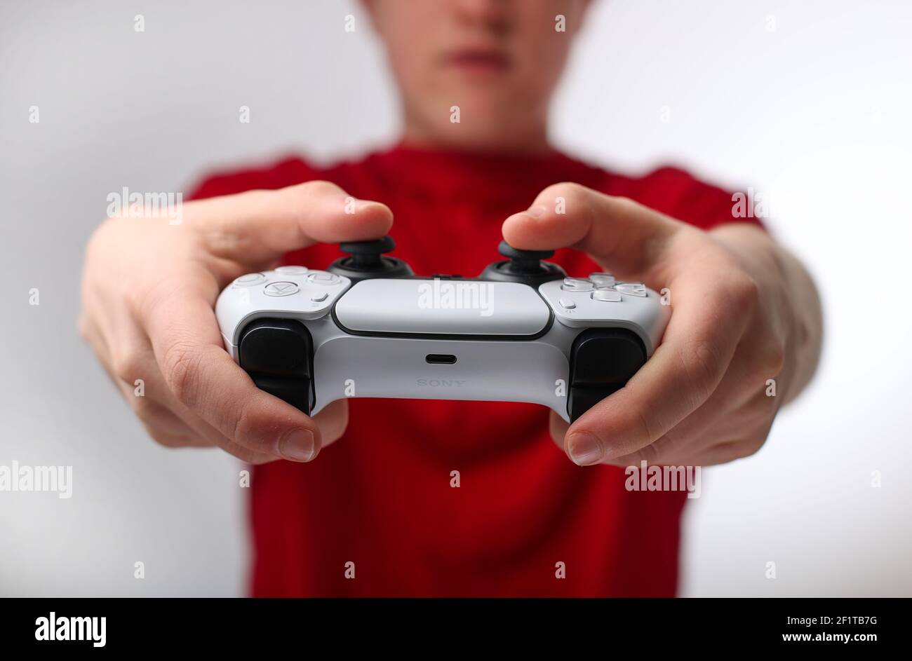 Teenager playing on a Playstation 5 or PS5 Stock Photo