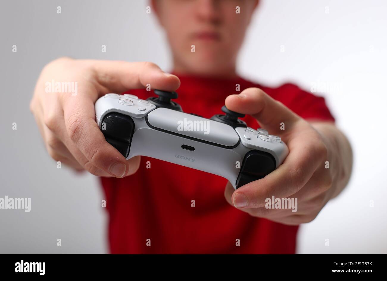 Teenager playing on a Playstation 5 or PS5 Stock Photo
