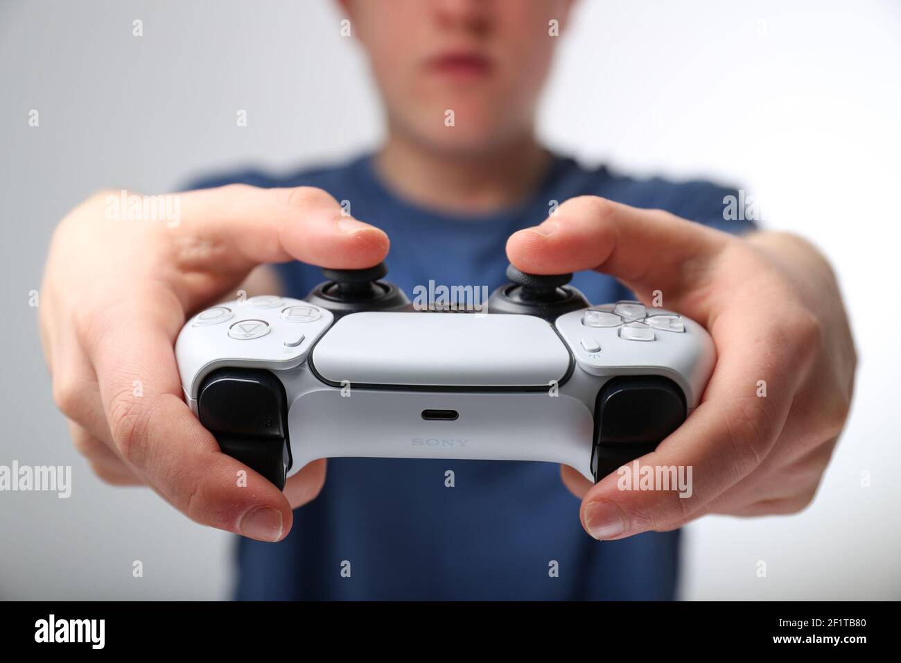 Teenager playing on a Playstation 5 or PS5 Stock Photo