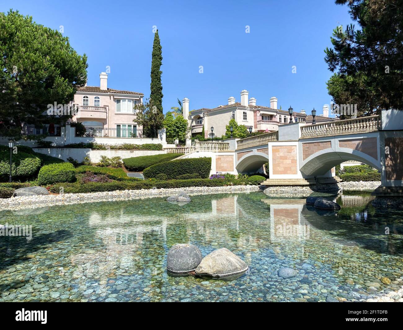 Public Park with green garden and landscape design with water pond and water stream Stock Photo