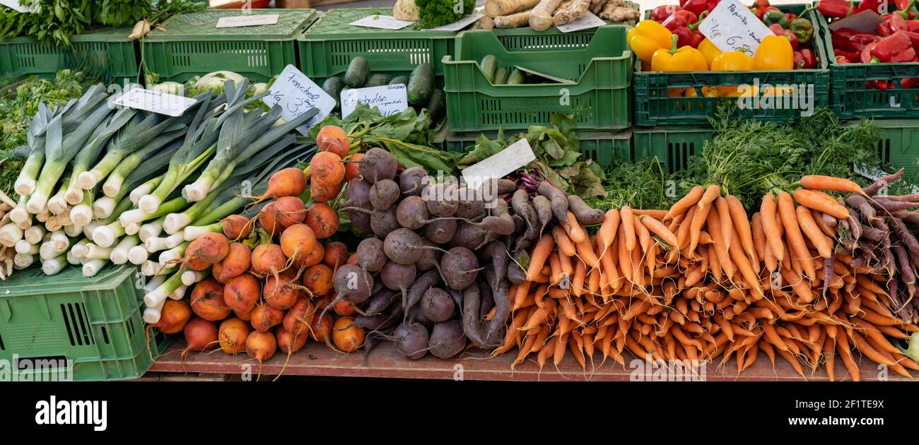 Panorama view of a farmer market stall with many organic vegetables for ...