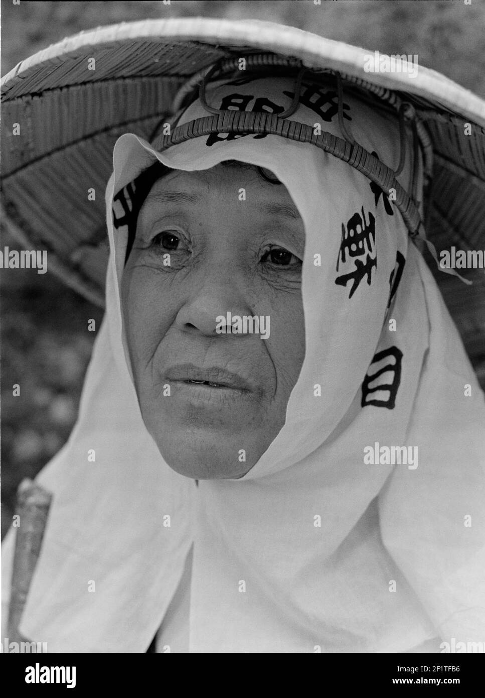 female pilgrim at Koyasan. Woman with straw hat , Koyasan , Japan Stock Photo