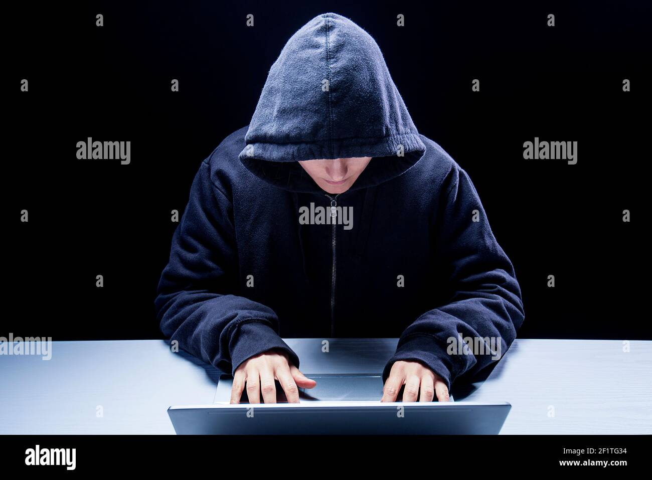 Hacker in data security concept using laptop in Cyber attack Stock Photo