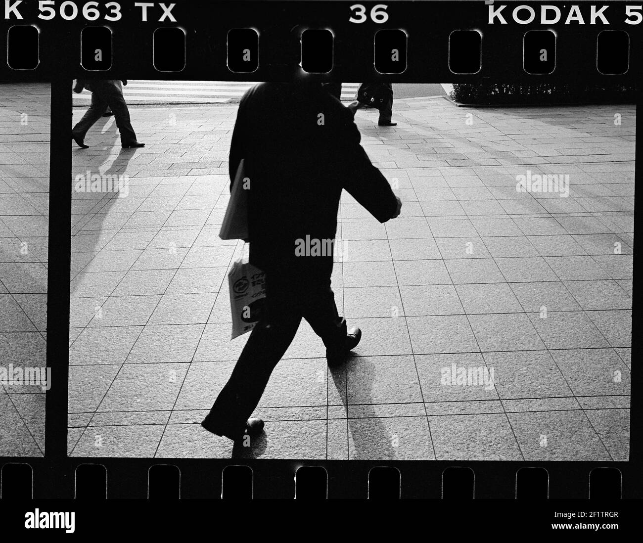 Business person walking Tokyo, Japan Stock Photo
