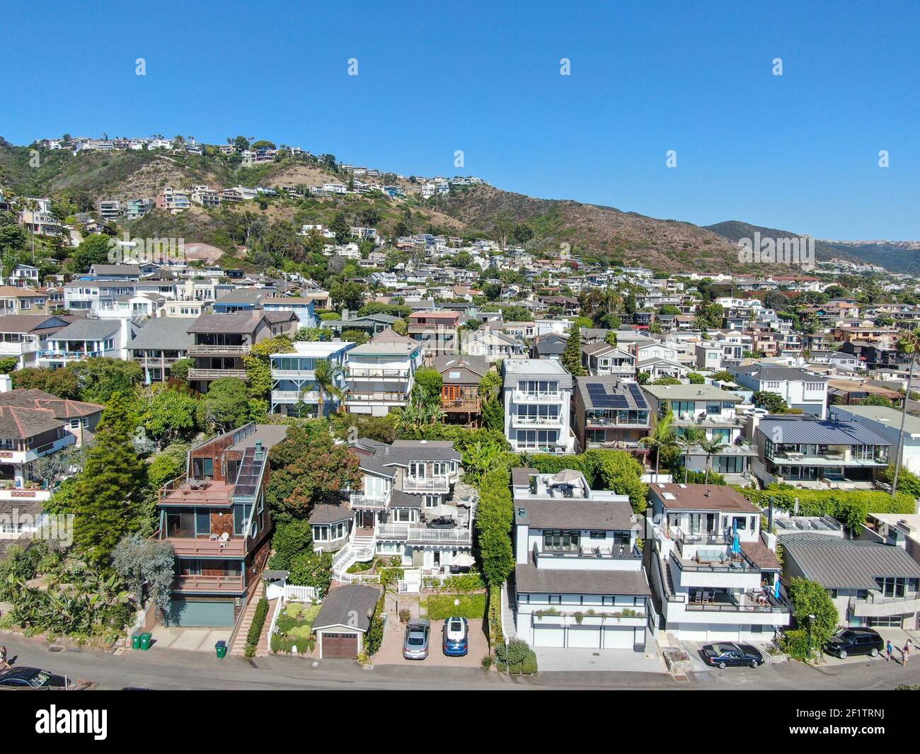 Aerial view of Laguna Beach coastline town with houses on the hills
