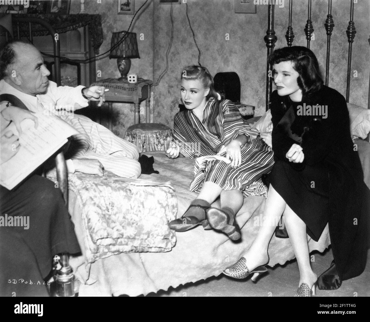 Director GREGORY LA CAVA GINGER ROGERS and KATHARINE HEPBURN on set candid  filming STAGE DOOR 1937 director GREGORY LA CAVA from the play by Edna  Ferber and George S. Kaufman RKO Radio