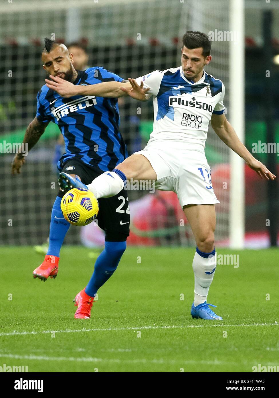 MILAN, ITALY - MARCH 8: Atruro Vidal of Internazionale and Remo Freuler of Atalanta battle for possession during the Serie A match between Internazion Stock Photo