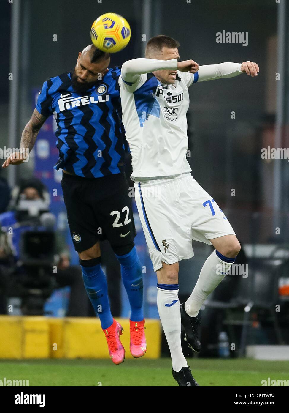 MILAN, ITALY - MARCH 8: Atruro Vidal of Internazionale and Josip Ilicic of Atalanta during the Serie A match between Internazionale and Atalanta BC at Stock Photo