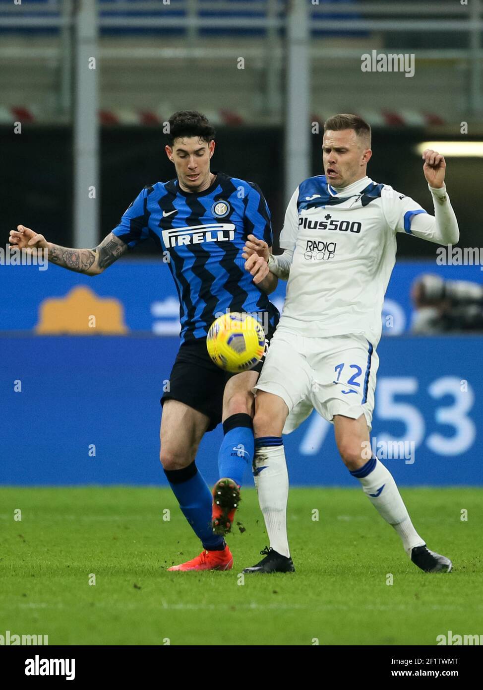 MILAN, ITALY - MARCH 8: Alessandro Bastoni of Internazionale and Josip Ilicic of Atalanta battle for possession during the Serie A match between Inter Stock Photo