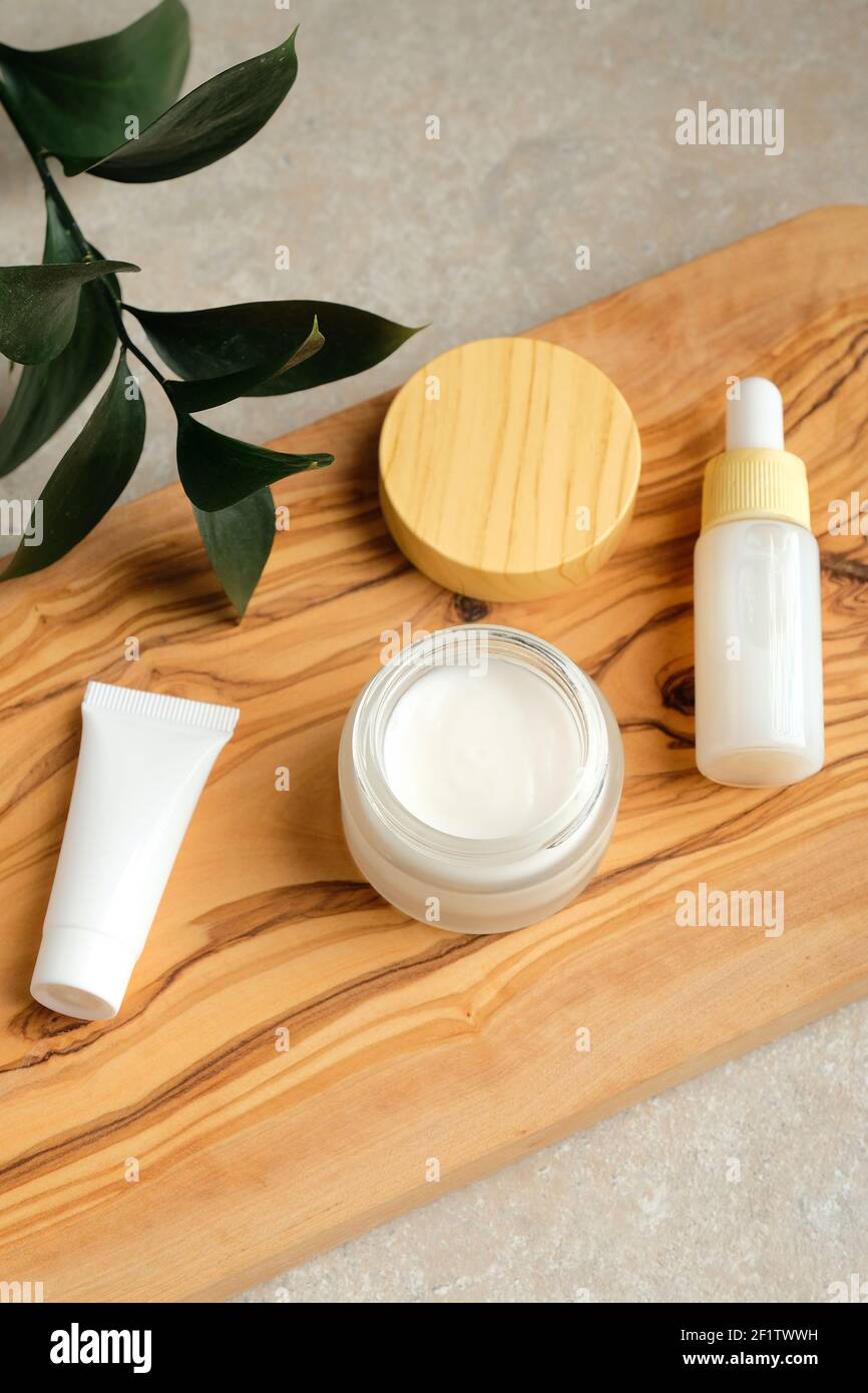 A set of bottles and tubes of cosmetics, jars for skin care with