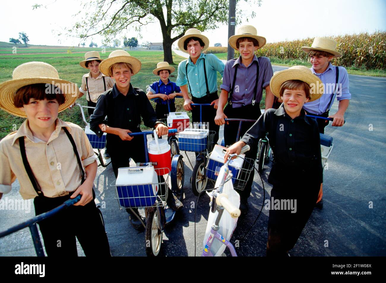 Portrait of a group of Amish school boys with their bicycles and scooters, Lancaster County, Pennsylvania, USA Stock Photo