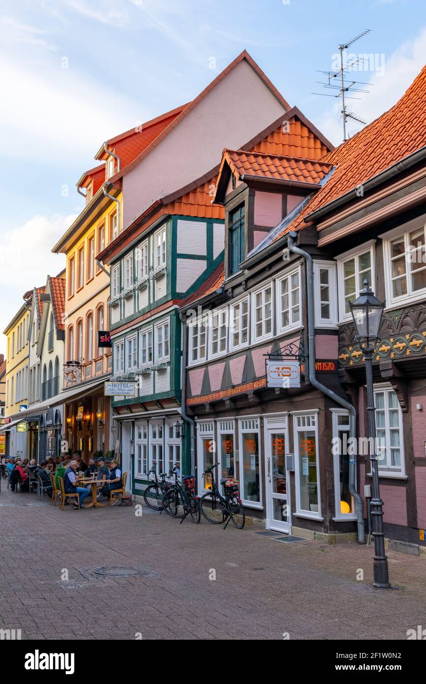 People enjoy a beautiful summer evening out in the streets of the historic old town of Celle Stock Photo