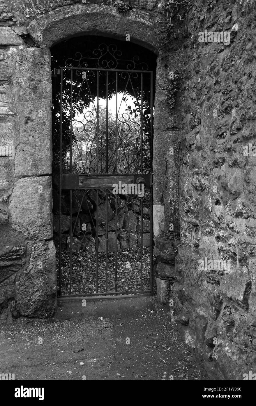 March 2021 - Gateway in through an old stone wall Stock Photo