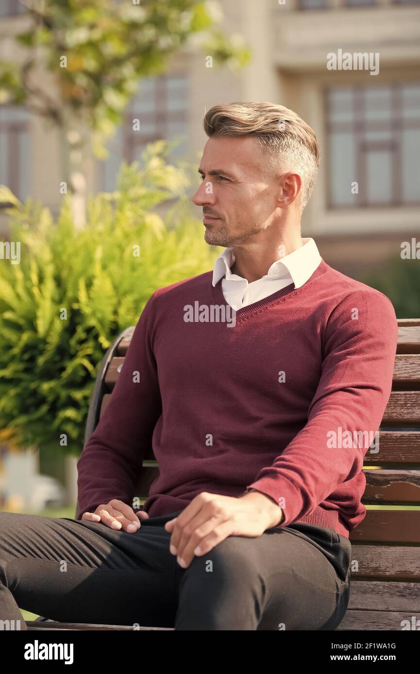Lunch break. Time for yourself. Man in formal clothes outfit relax sit  bench in park. Businessman formal clothing manager need time to relax.  Pleasant moments of entrepreneurship. Waiting concept Stock Photo 
