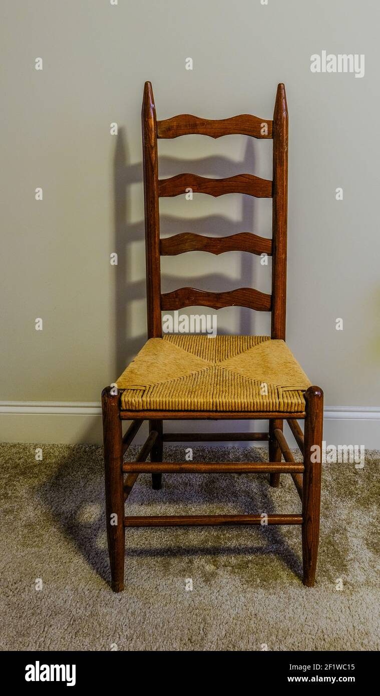 Hand-painted decoration on double doors in traditional with rush-seated  ladder-back chair and terracotta tiled floor Stock Photo - Alamy