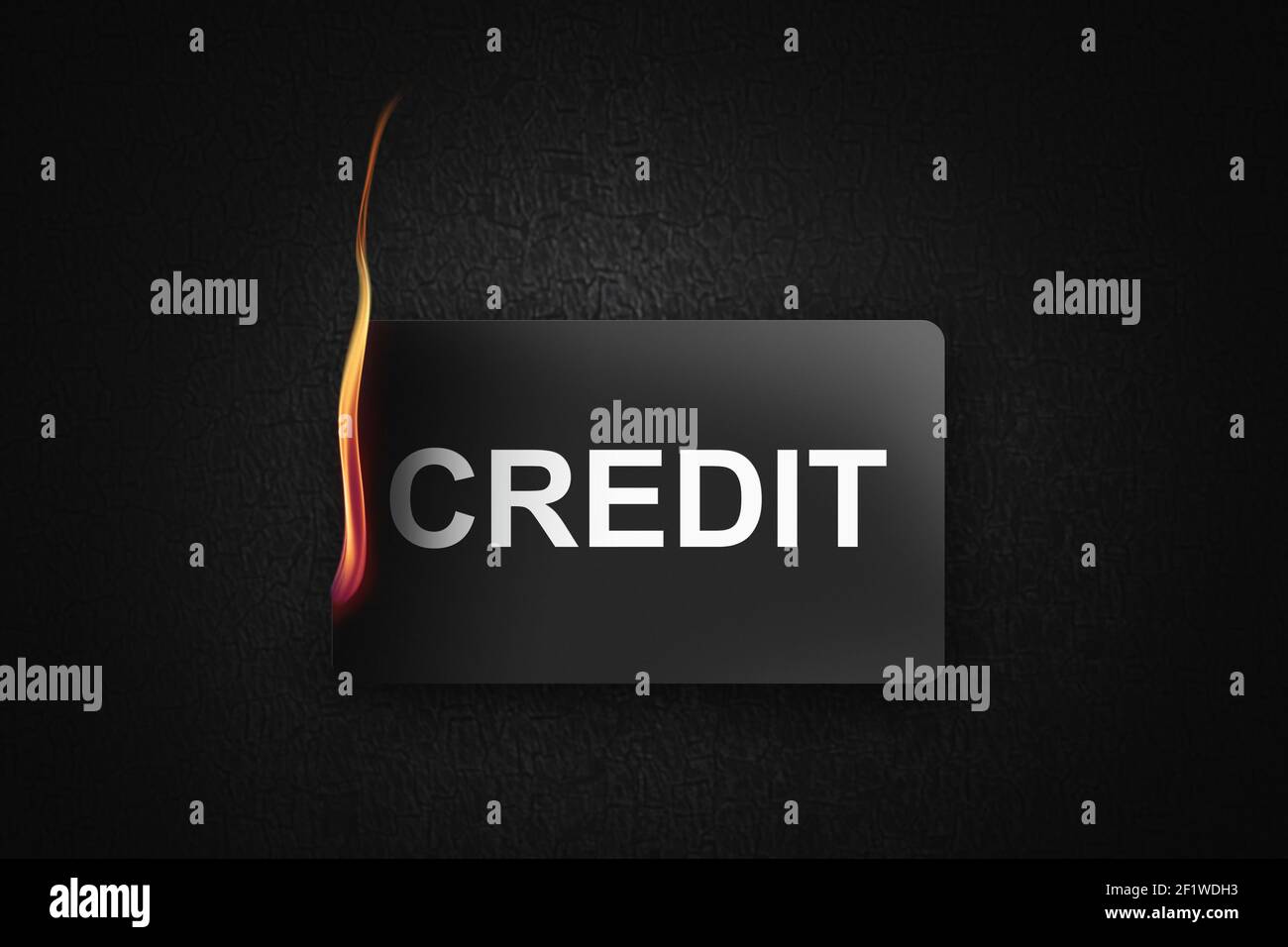 Burning credit card on black background Stock Photo