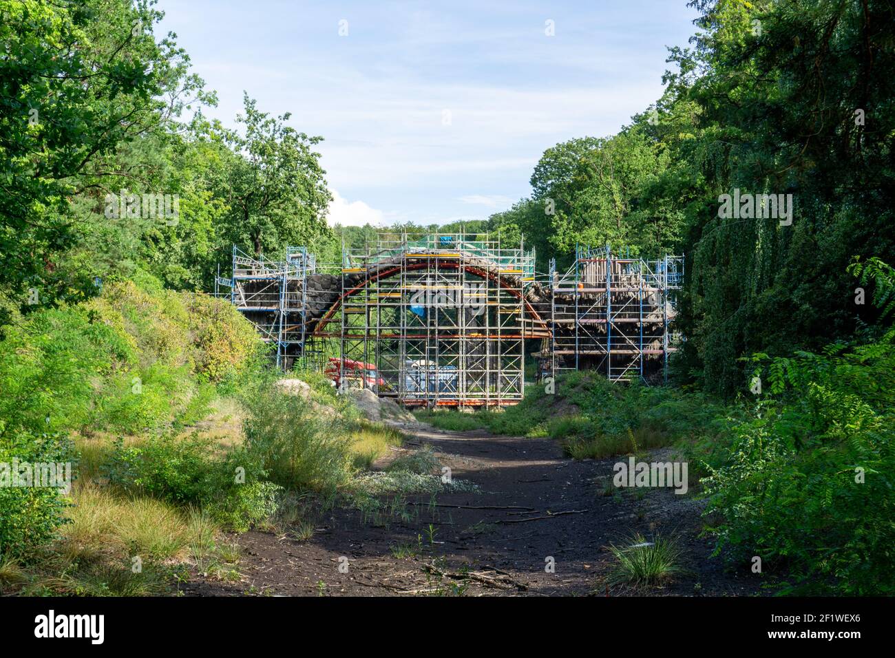 View of the historic Rakotz Bridge covered in scaffolding for renovation work Stock Photo
