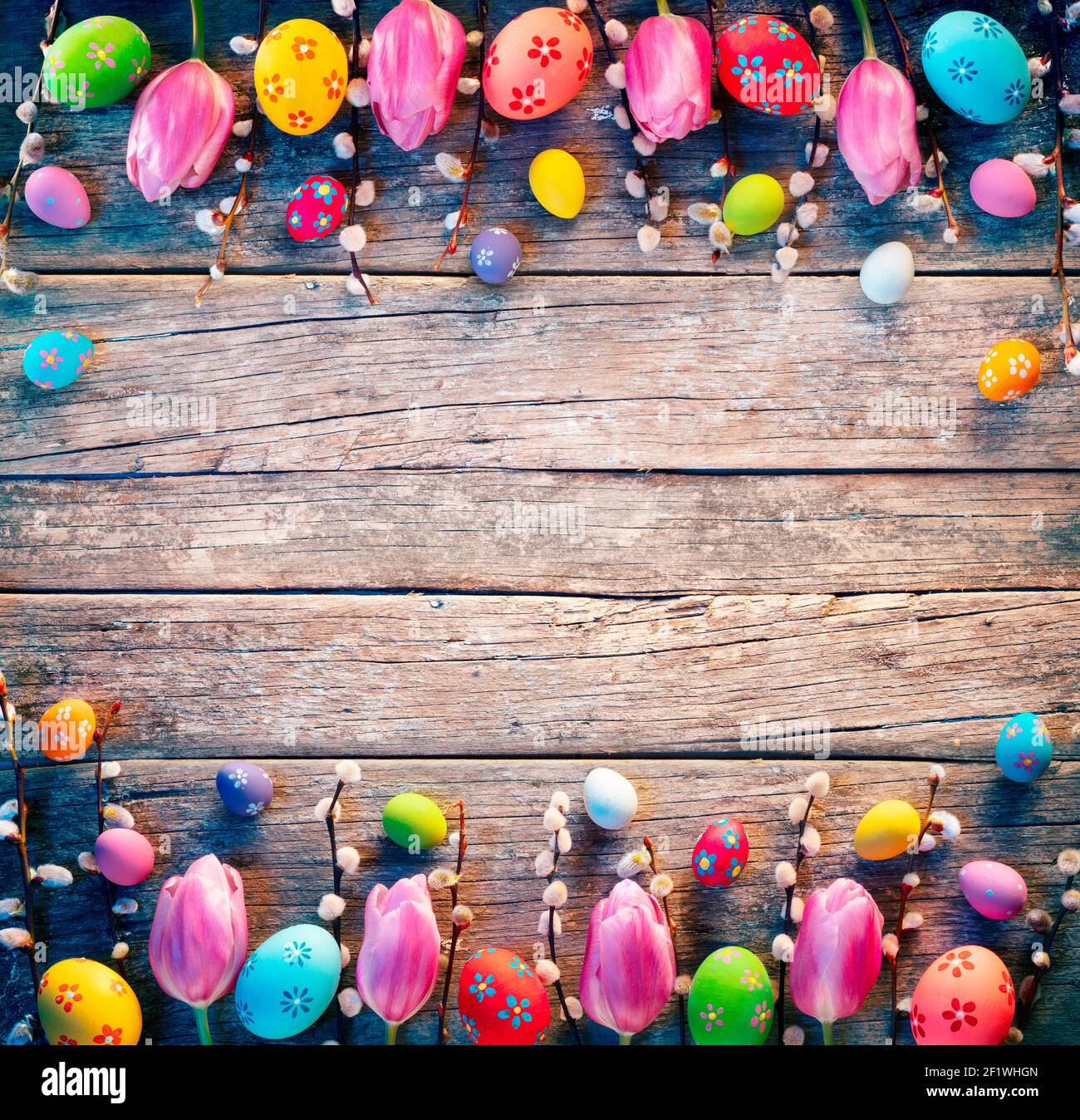 Vintage Easter Decoration - Painted Eggs With Willows Branches And Tulips On Rustic Table Stock Photo
