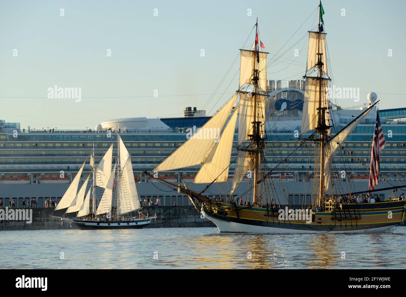 The brig Lady Washington sailing in front of the cruise ship Golden