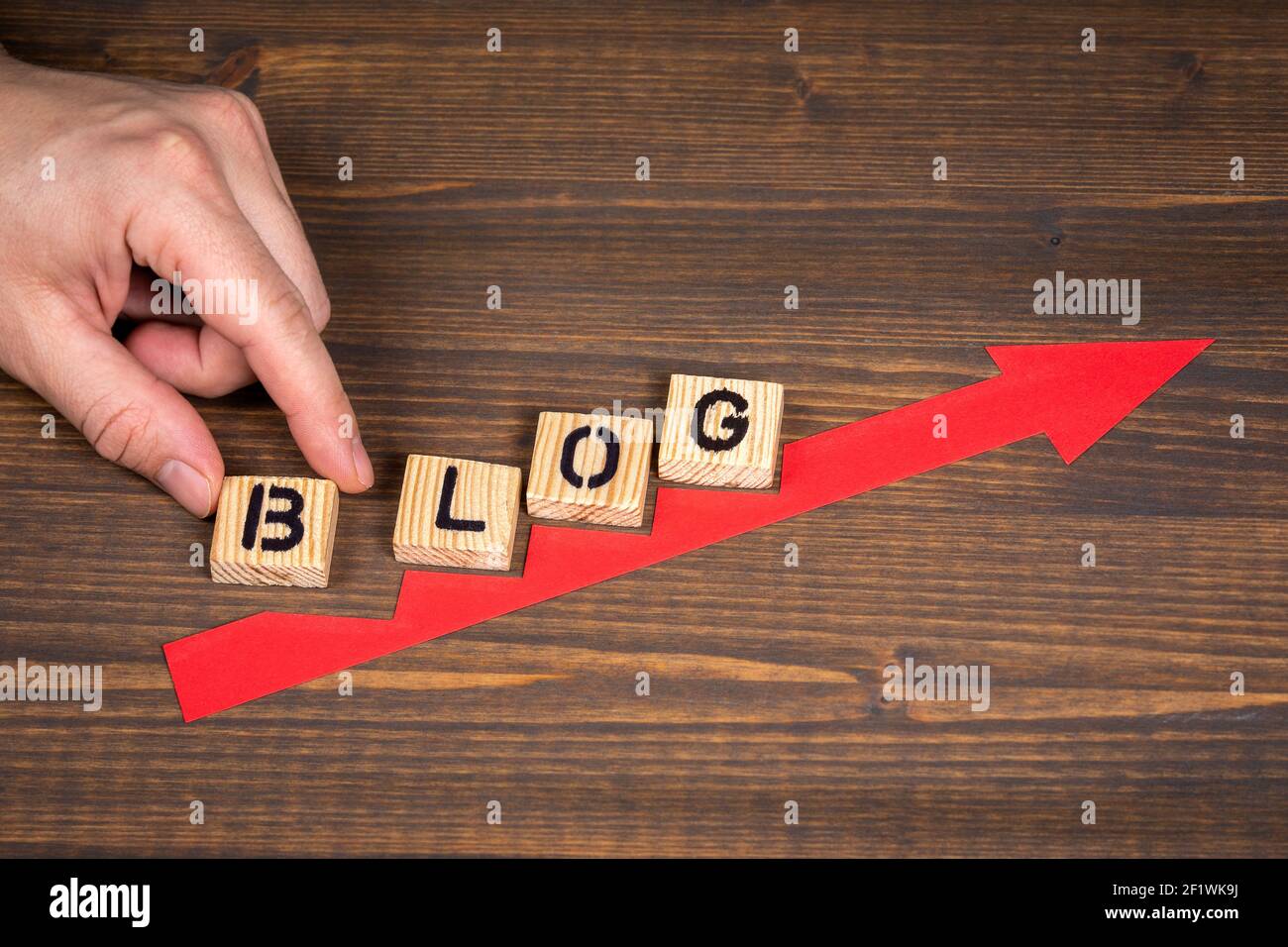 BLOG, business concept. Red arrow indicates the development and growth ...