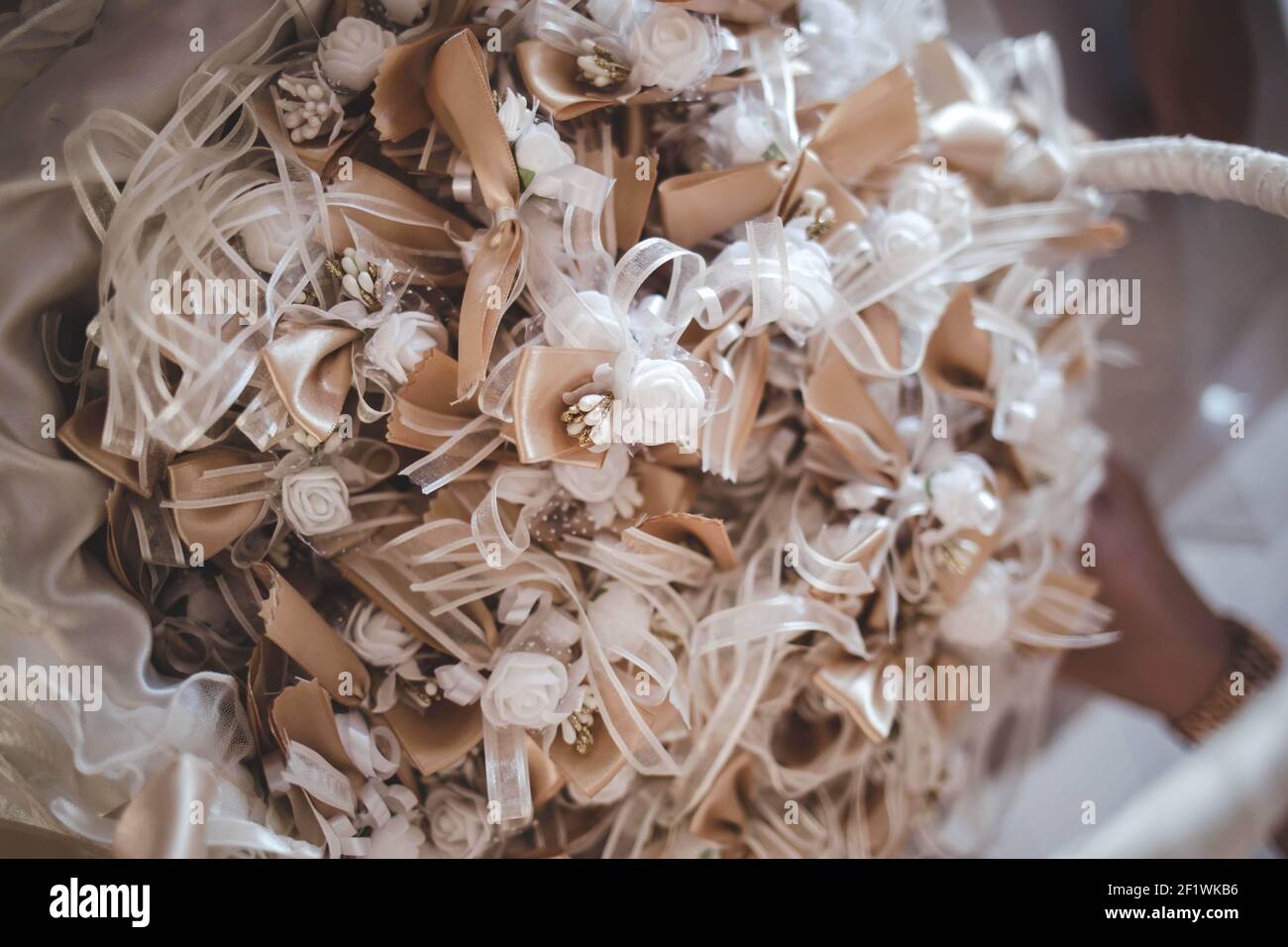 A closeup of a beautifully decorated flower bouquet for a wedding with a blurry background Stock Photo