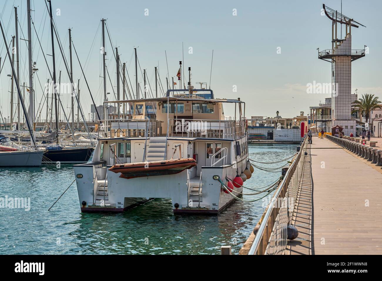 catamaran moored in the harbor, harbor of the Grao maritime district in the city of Castellon, Spain, Europe Stock Photo