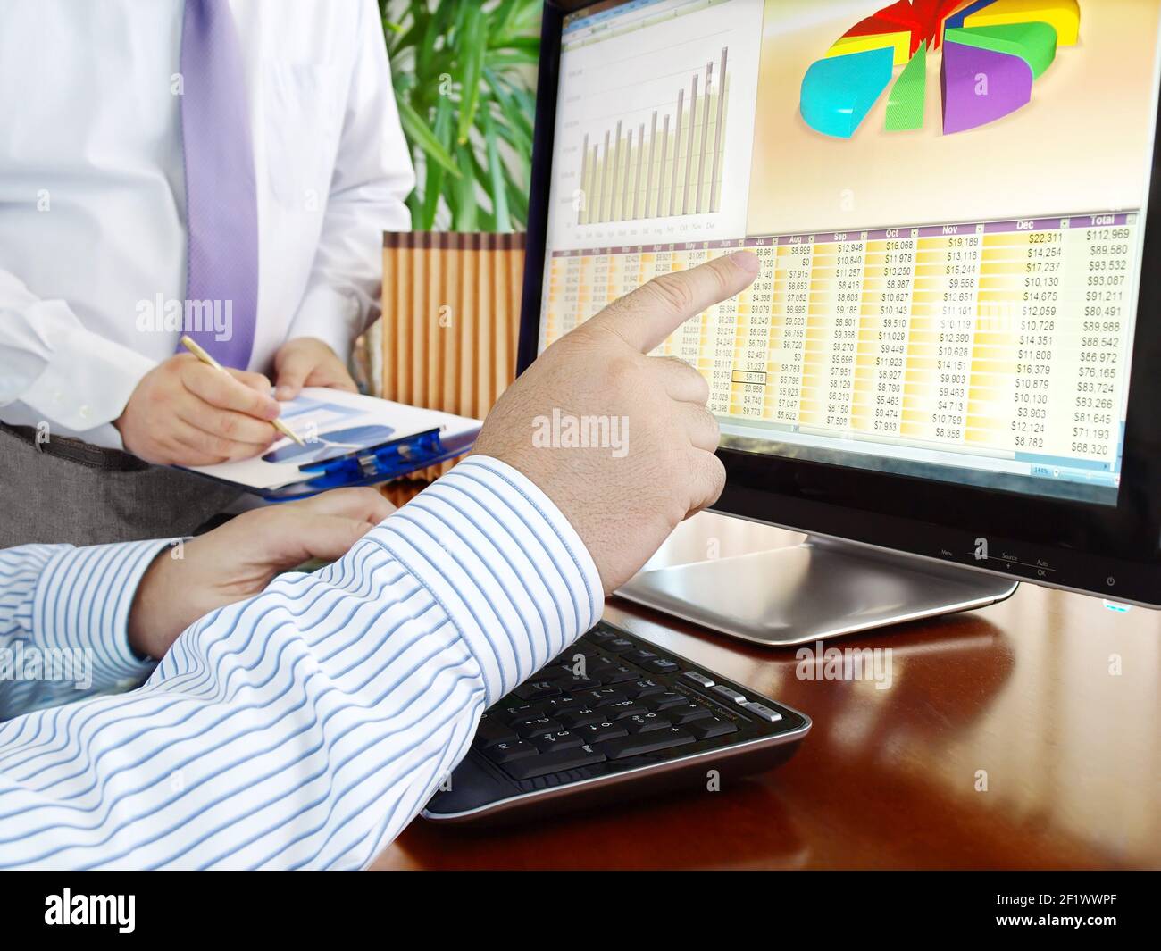 Analyzing data on computer Stock Photo