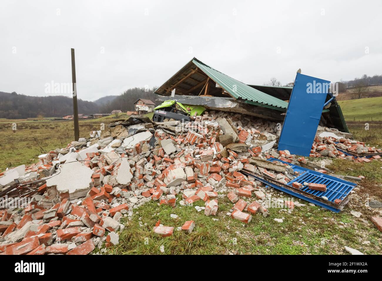 A catastrophic earthquake measuring 6.3 hit Petrinja and was felt in most of the country. 7 people died during earthquake. Destroyed garage with a tra Stock Photo